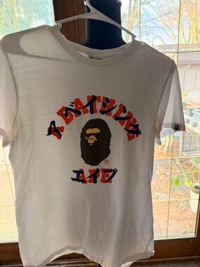 Bape White Graphic Tee with Black Ape Head and Red/Blue Japanese Text